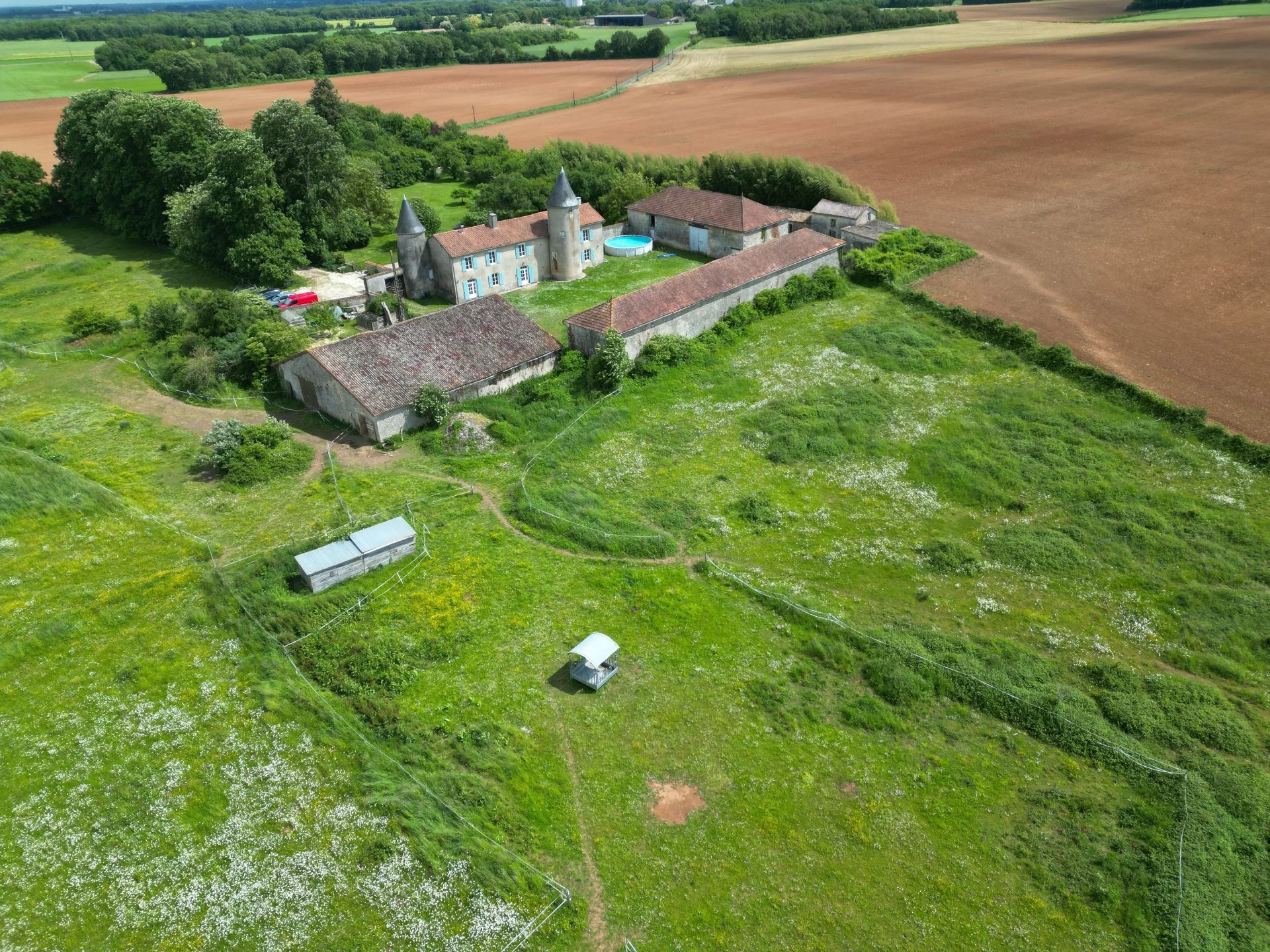 Historic chateau with impressive outbuildings, land and woodland, Poitou-Charentes – France – BVI79104