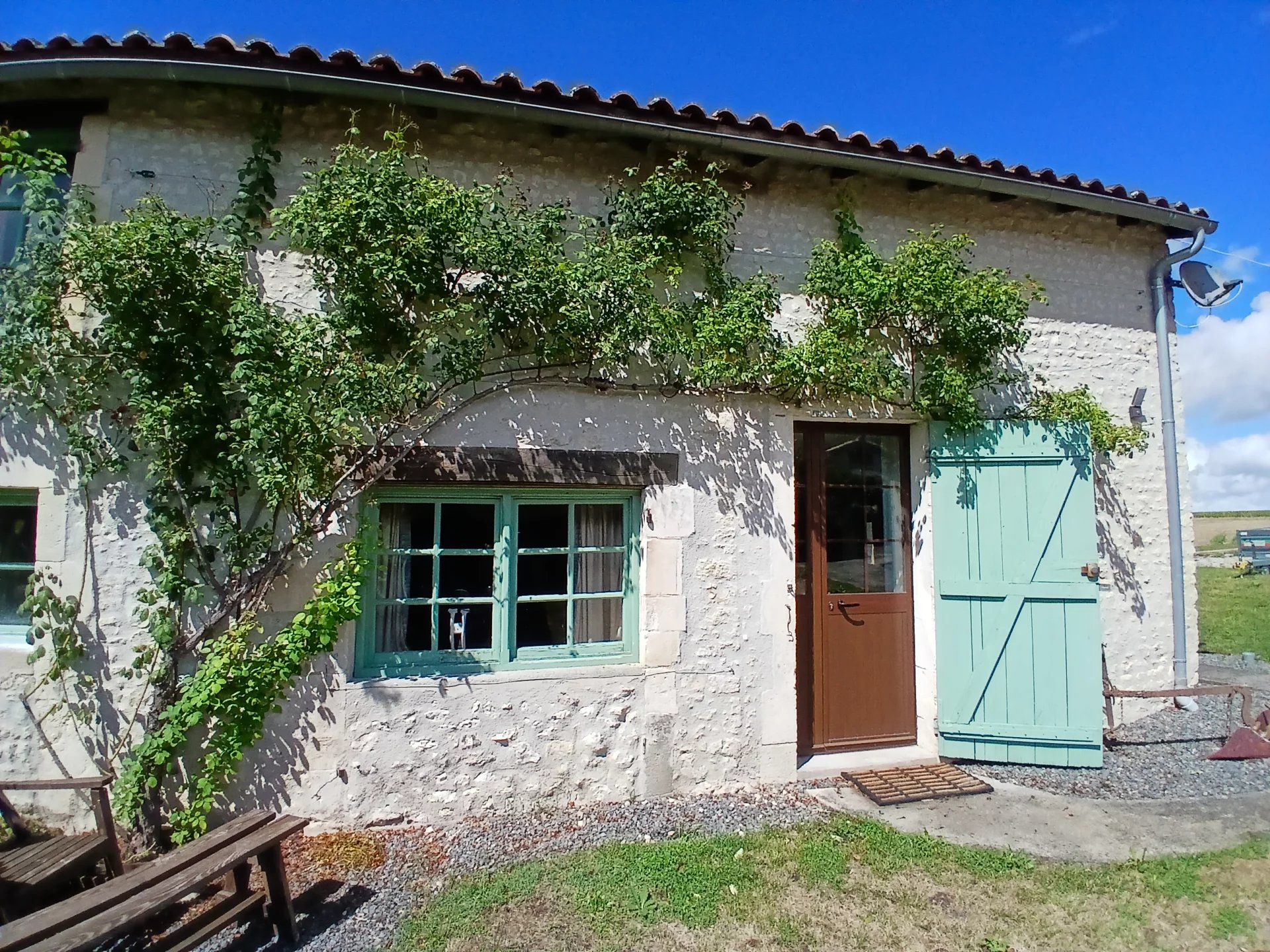 Two picturesque stone cottages set in the countryside, Poitou-Charentes – France – BVI82306