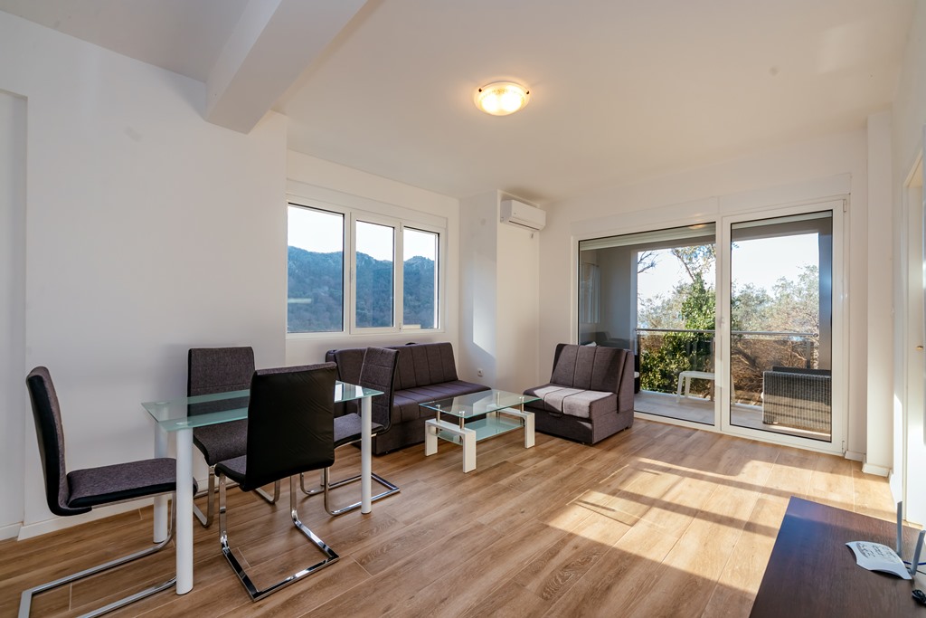 Apartment with sea views in residential building with an elevator in Rafailovici