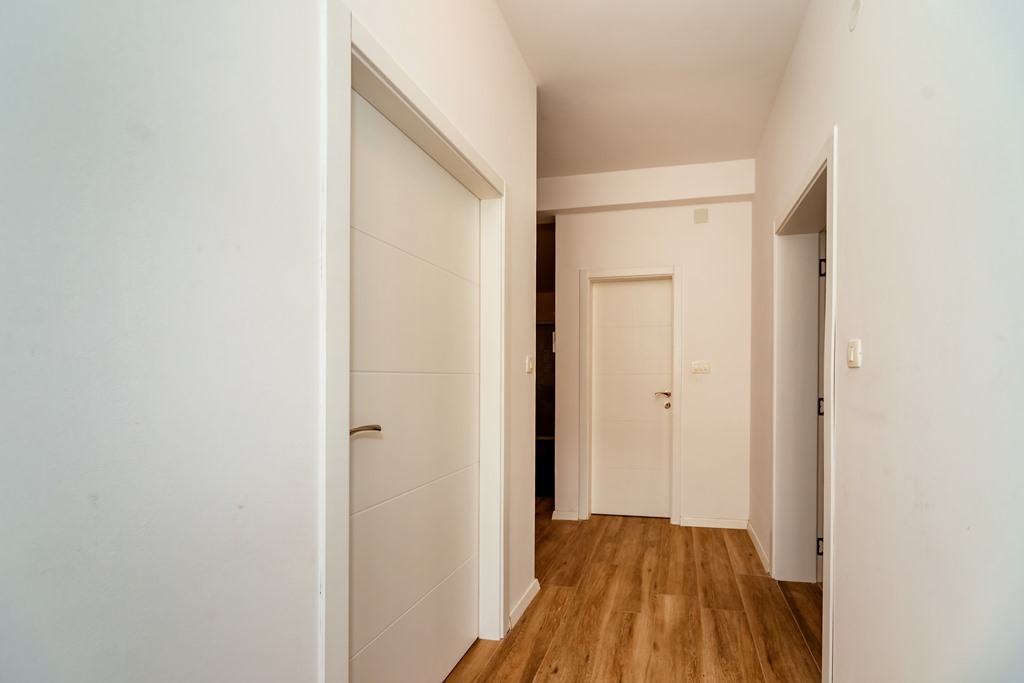 Apartment with sea views in residential building with an elevator in Rafailovici