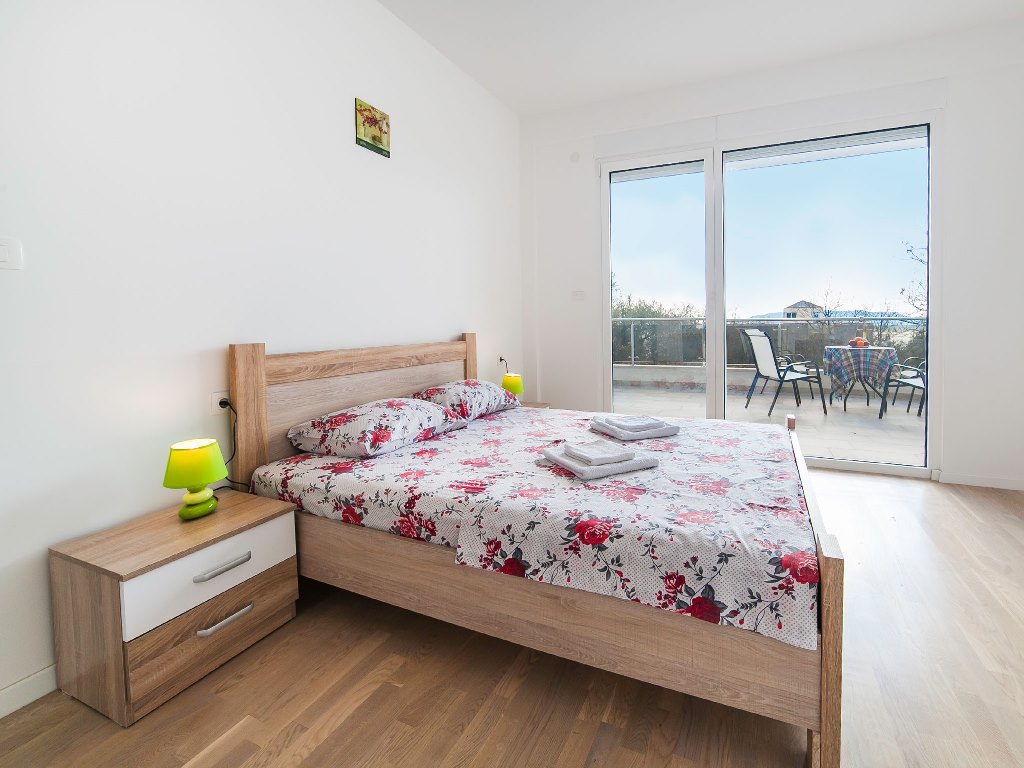 Apartment with sea views in residential building with an elevator in Rafailovici