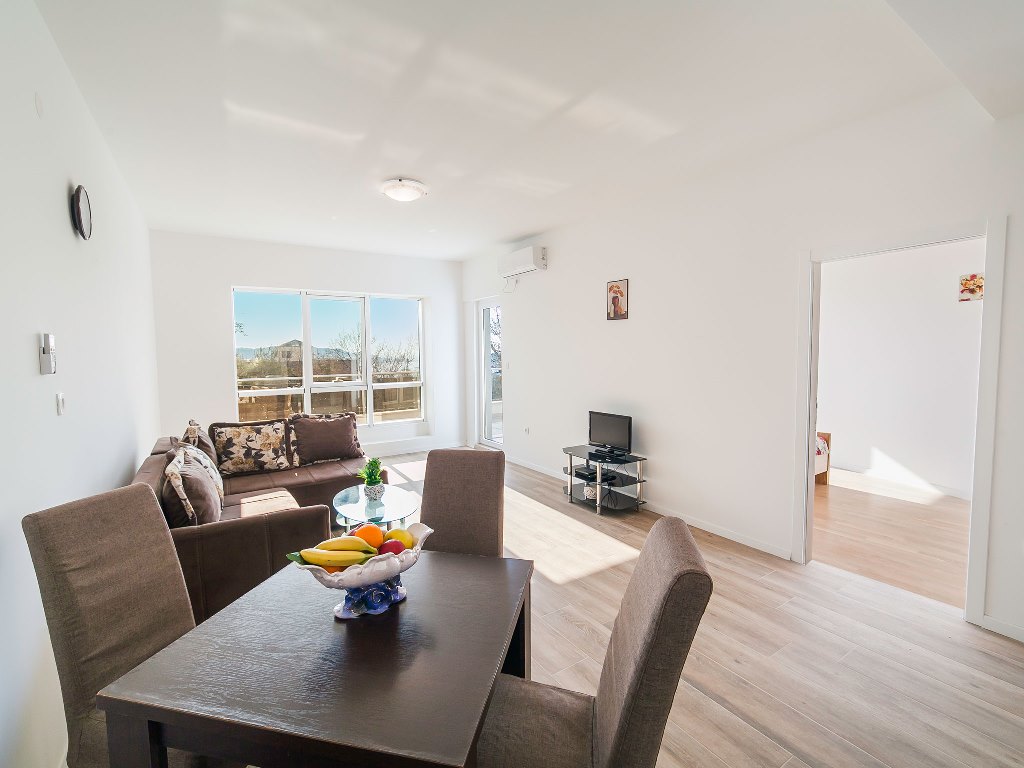 Apartment with sea views in residential building with an elevator in Rafailovici