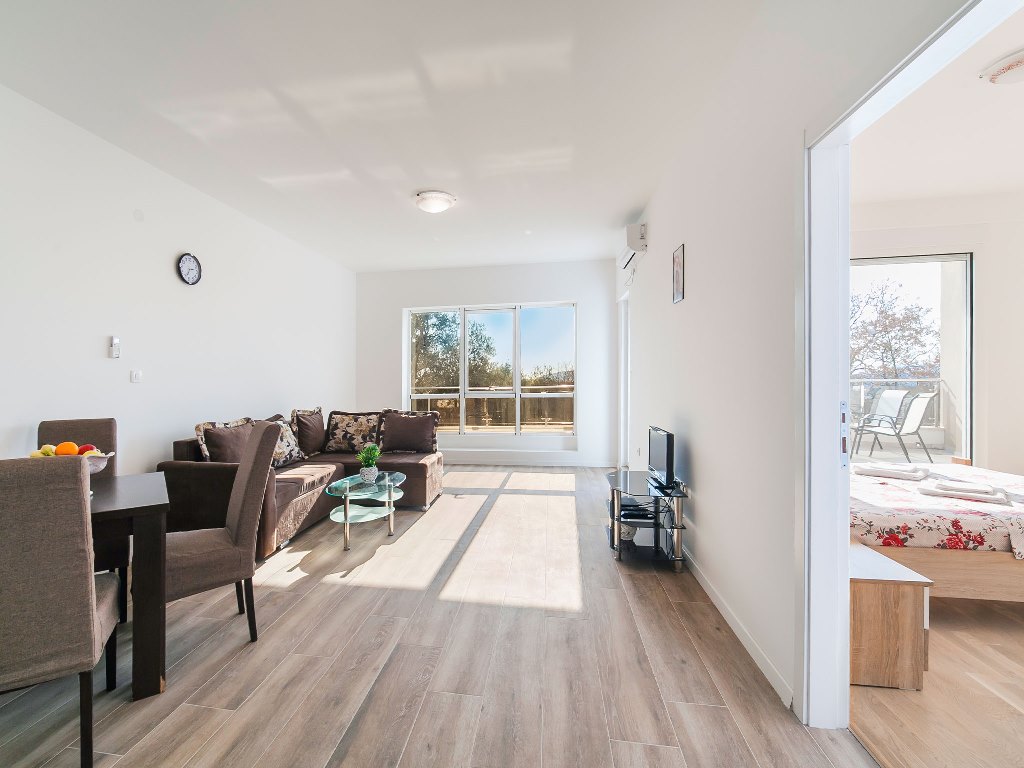 Apartment with sea views in residential building with an elevator in Rafailovici