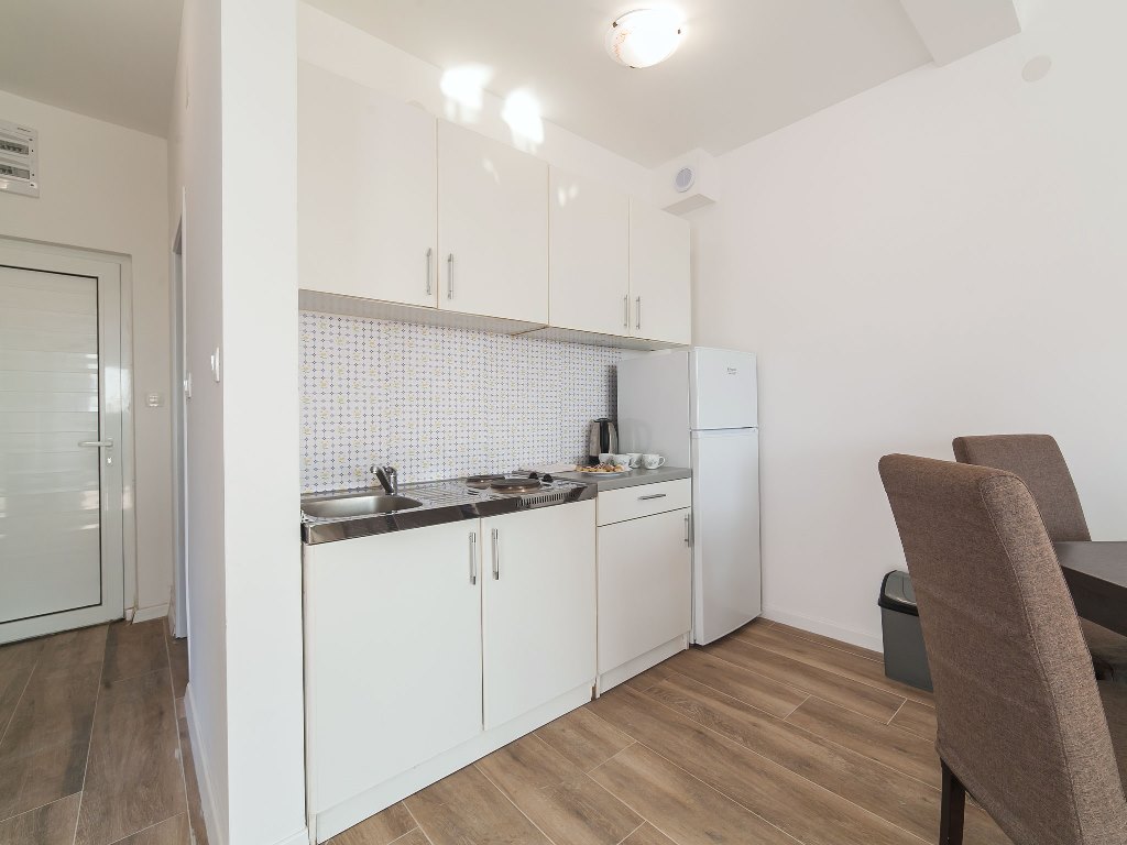 Apartment with sea views in residential building with an elevator in Rafailovici