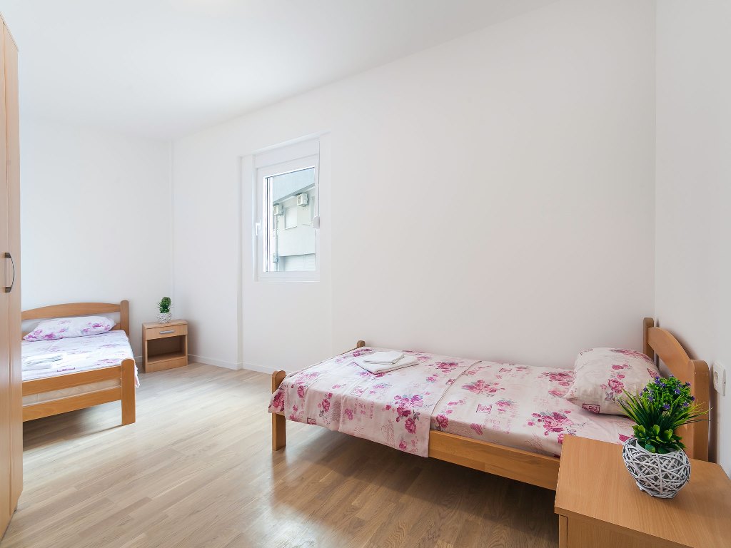 Apartment with sea views in residential building with an elevator in Rafailovici