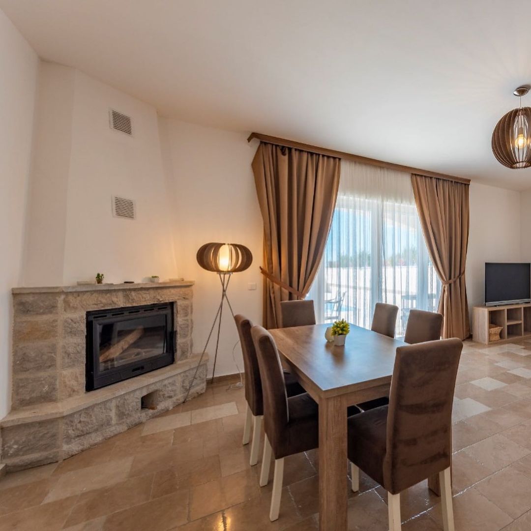 A complex of 6 villas with a swimming pool with an open sea view