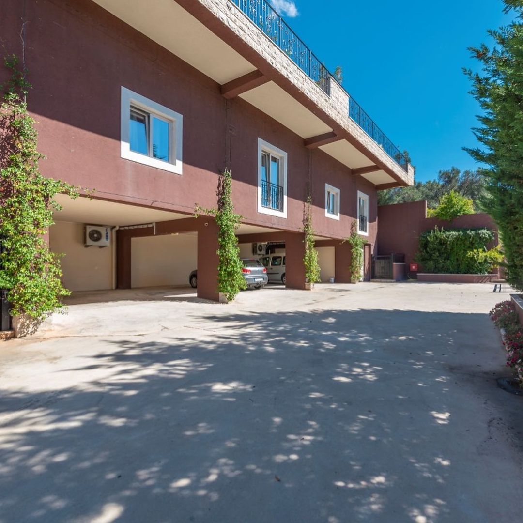 A complex of 6 villas with a swimming pool with an open sea view