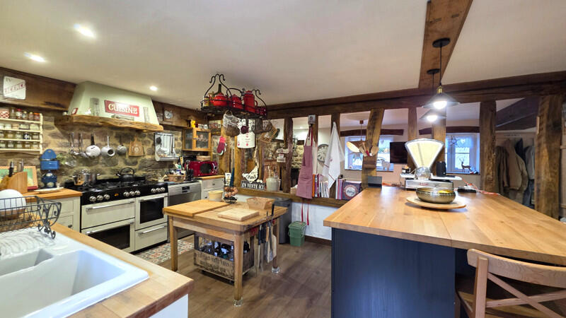 A rare opportunity to acquire a substantial home with a gîte and a range of outbuildings.