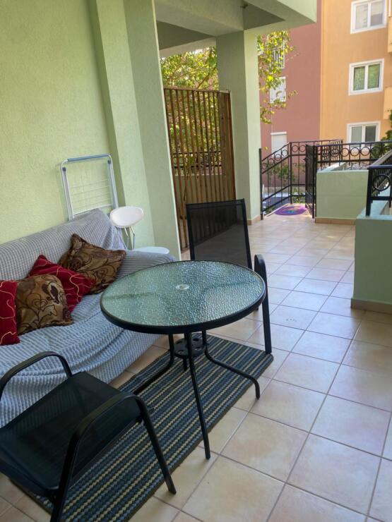 Stylish two-bedroom apartment for sale in a club house with a swimming pool and a real garden.