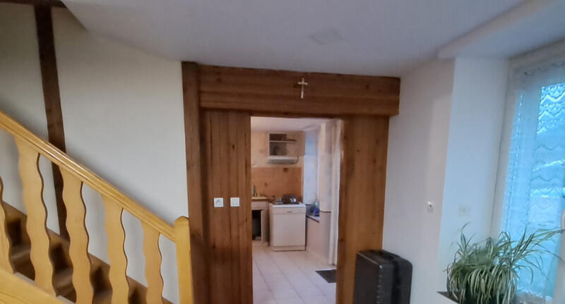 A spacious 4-bedroom stone house with garage and land, ideally located near Flers and Tinchebray-Bocage, offering easy access to all amenities