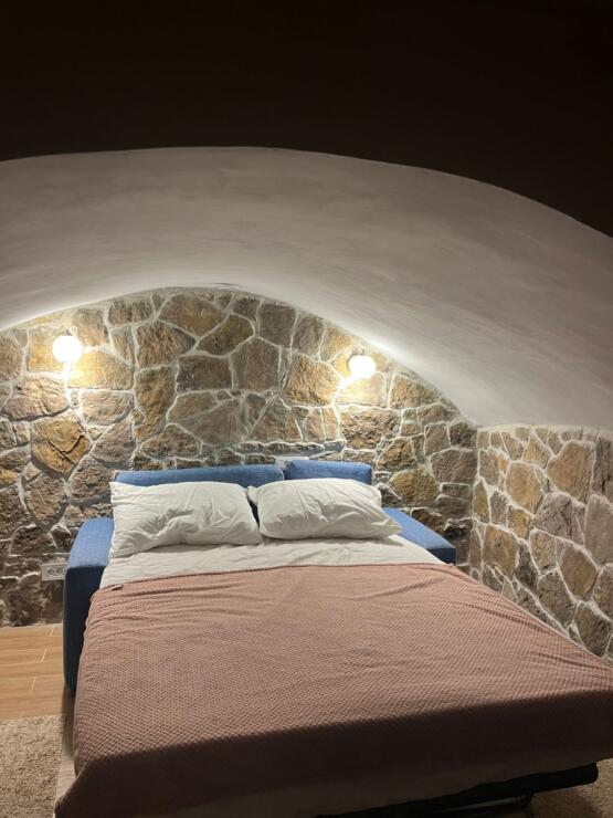 A restored 17th-century stone manor house, 208 m², on a 9,400 m² plot near Budva, is for sale.