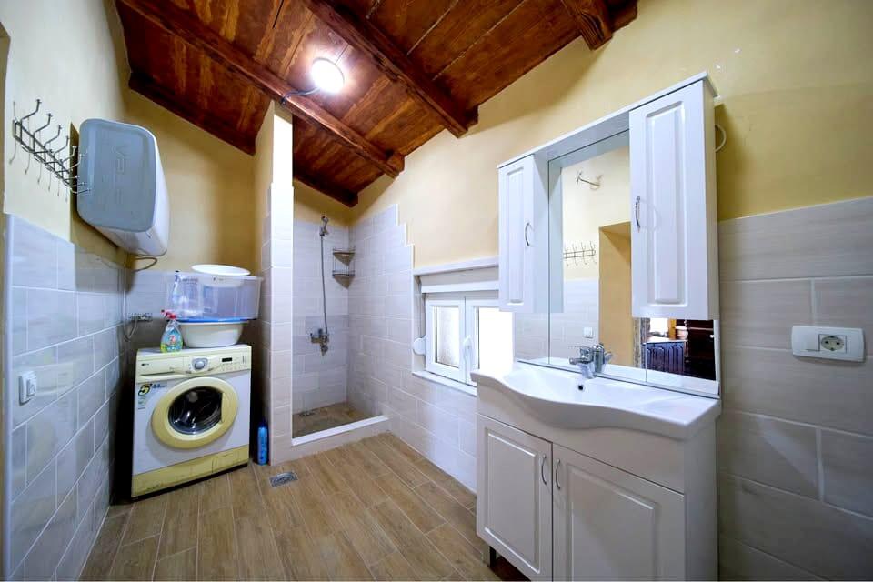 A restored 17th-century stone manor house, 208 m², on a 9,400 m² plot near Budva, is for sale.