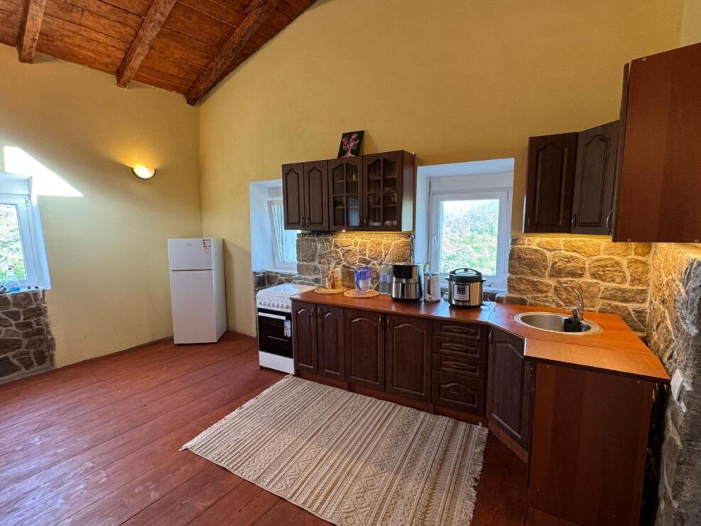 A restored 17th-century stone manor house, 208 m², on a 3700 m² plot near Budva, is for sale.