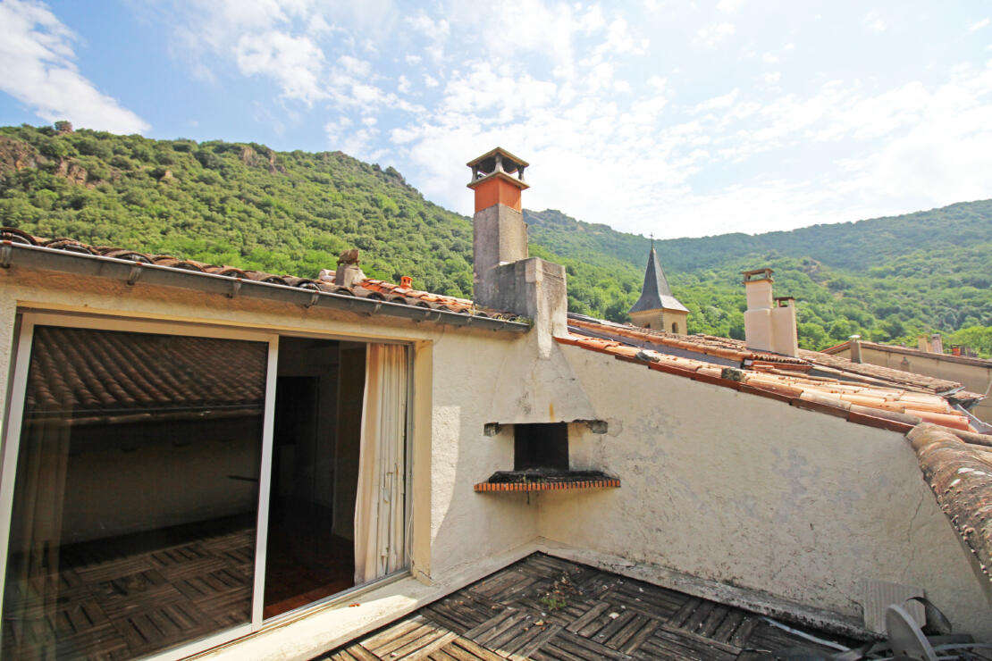 Spacious village property to be renovated with roof terrace on a charming street, near popular town of Revel