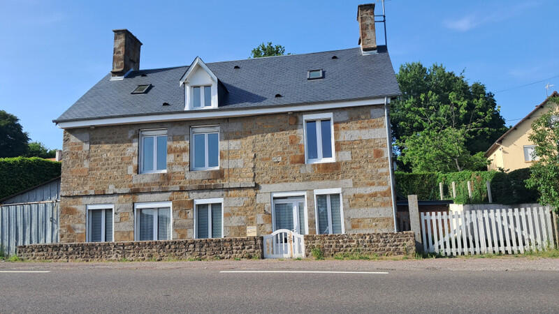A spacious 4-bedroom stone house with garage and land, ideally located near Flers and Tinchebray-Bocage, offering easy access to all amenities